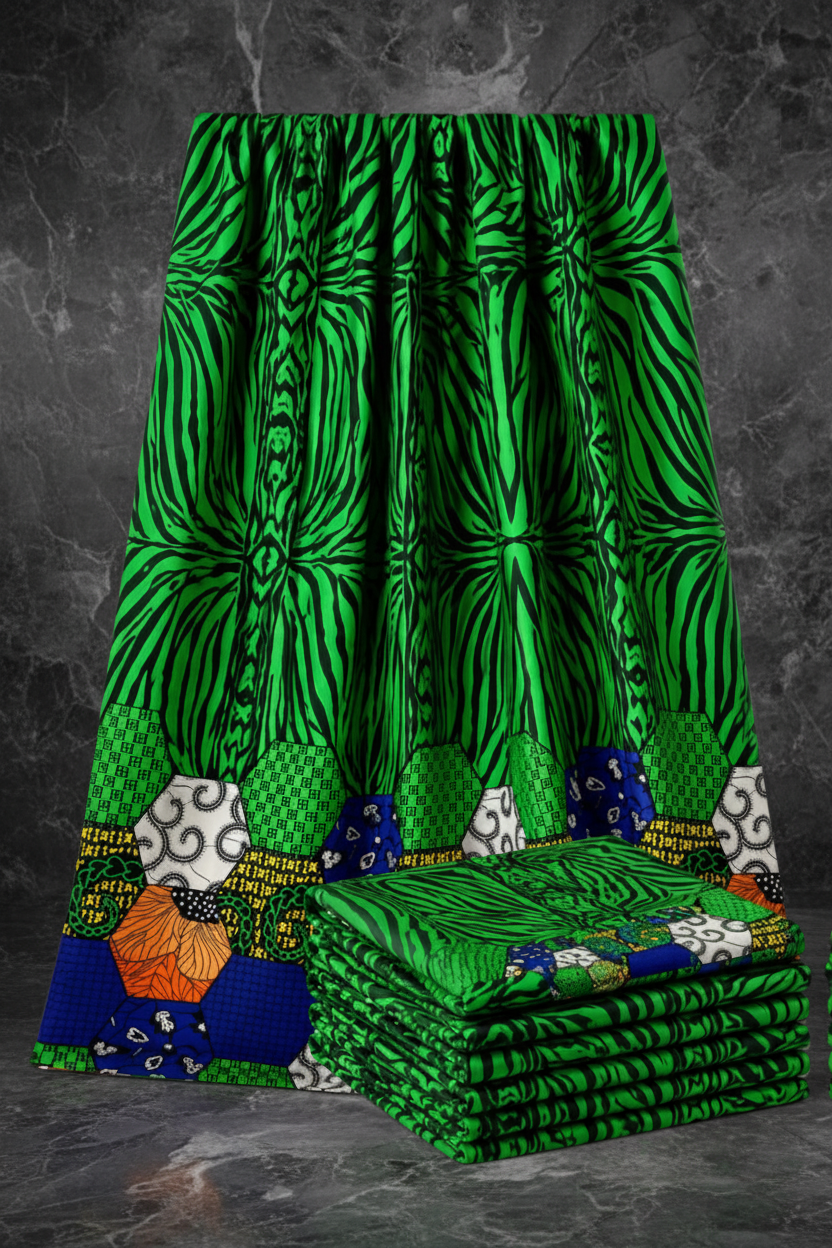 Stack of green fabric with various patterns on a white background