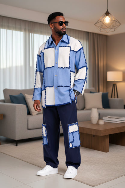 Man wearing a blue and white patterned shirt and pants in a living room.
