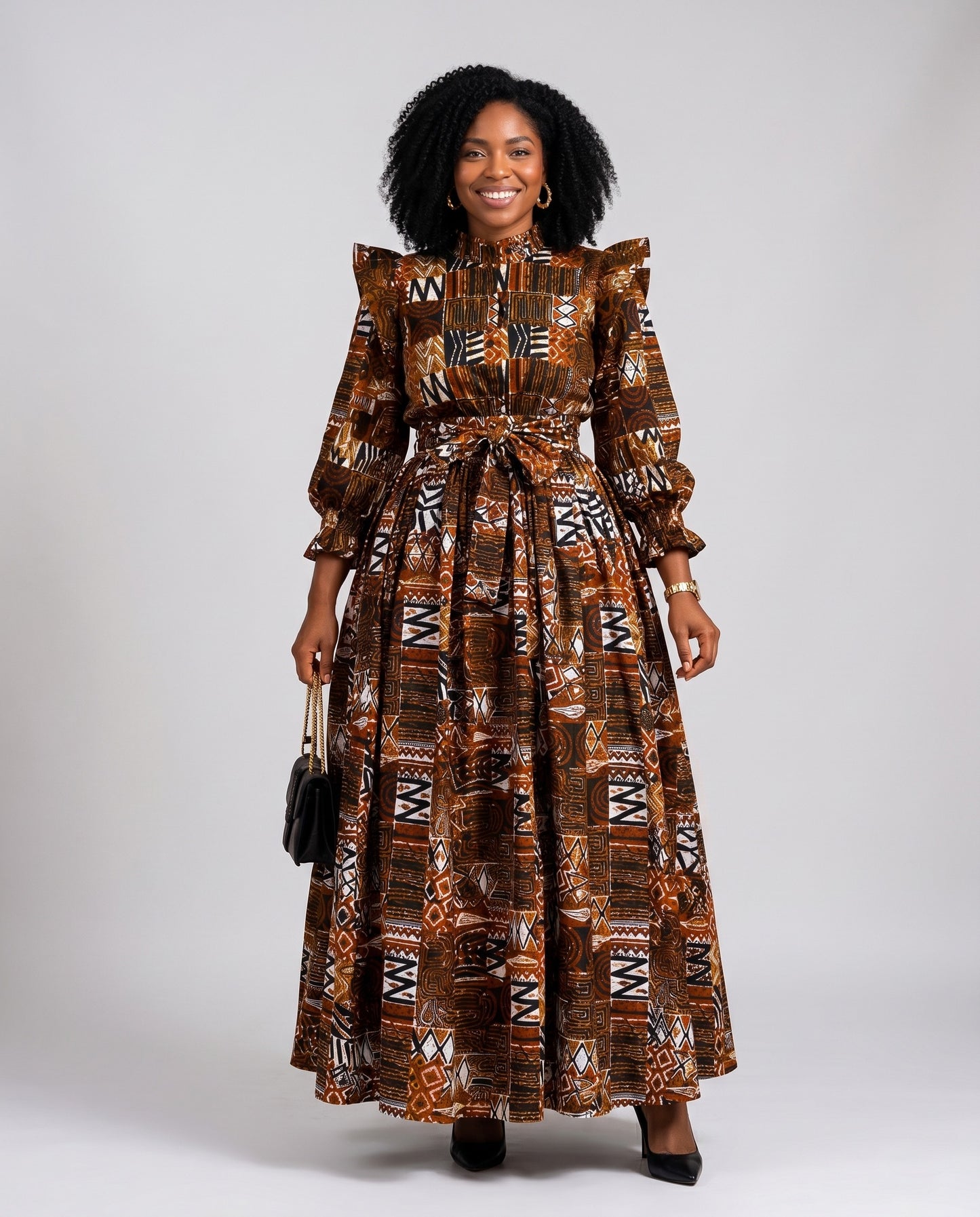 Woman wearing a patterned dress on a plain background