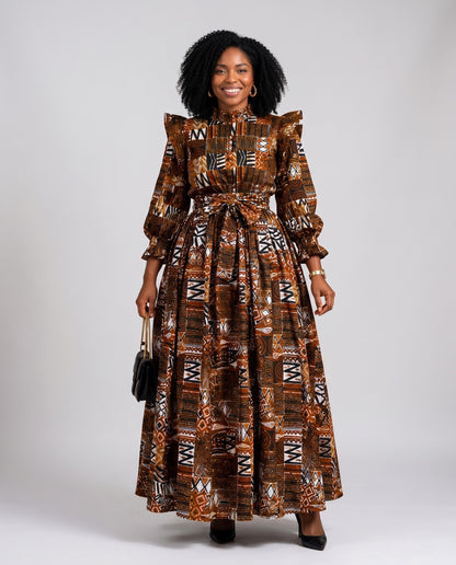 Woman wearing a patterned dress on a plain background
