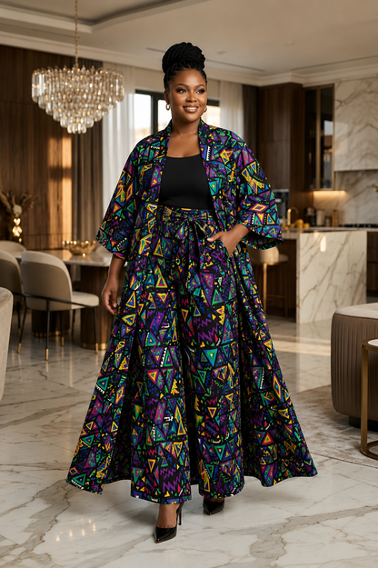 Woman in a colorful geometric patterned outfit standing in a modern interior setting.