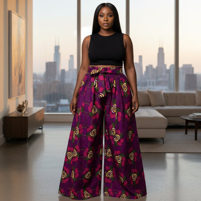 Purple patterned pants worn by a person on a white background