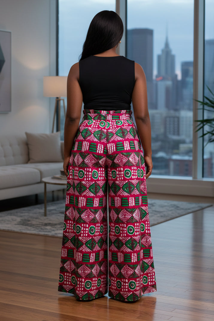Person wearing a vibrant pink and green patterned skirt on a white background