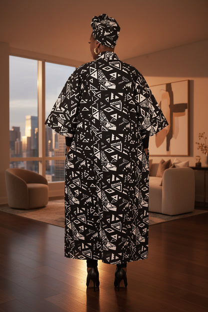 Person wearing a black and white patterned outfit on a white background