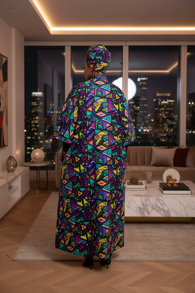 Colorful geometric patterned dress with matching headscarf on a white background