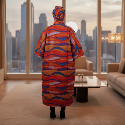 Colorful patterned garment with matching headscarf on a white background