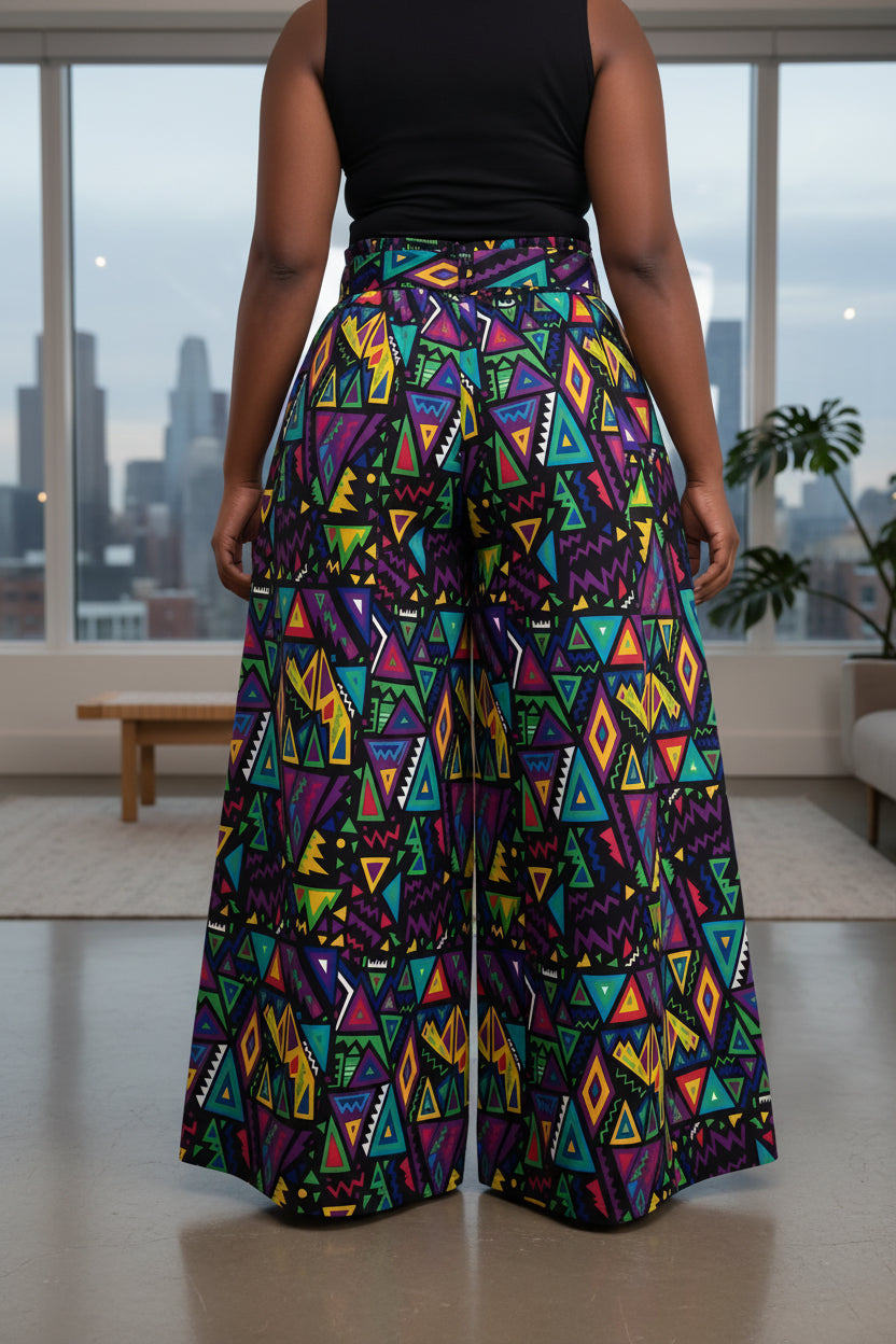 Colorful geometric patterned pants on a white background