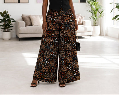 Woman in a stylish outfit standing in a modern living room.